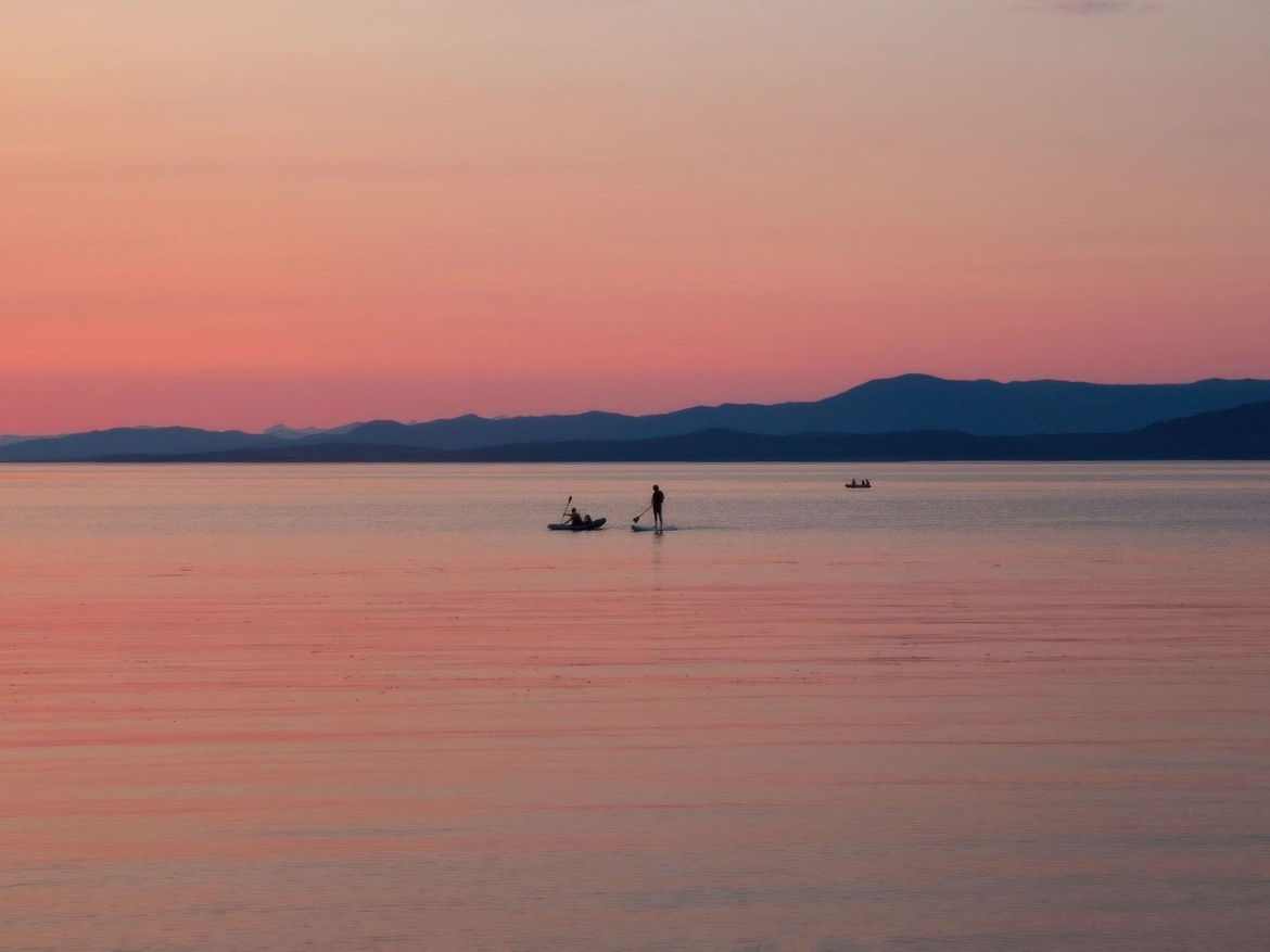 Paddleboarding at sunset near Rathtrevor Beach
