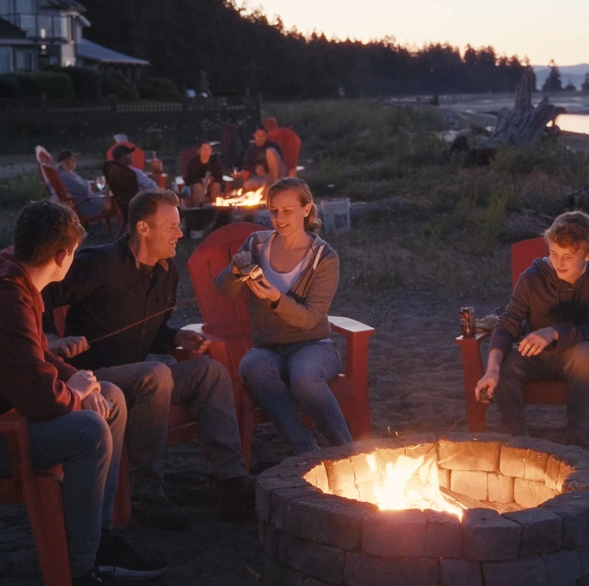 Family fun around a firepit at Beach Acres Resort